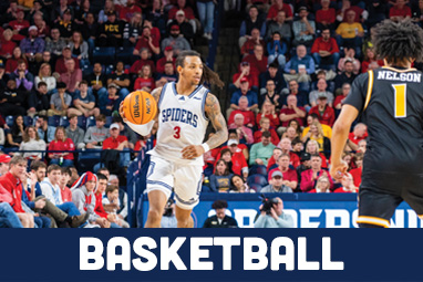 Basketball player dribbling down the court