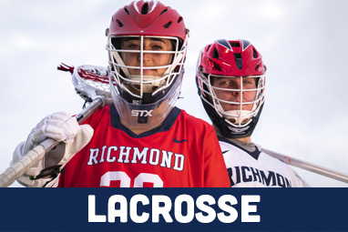 Two people with Lacrosse Gear standing next to each other.