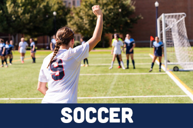 A girl about to do a corner kick.
