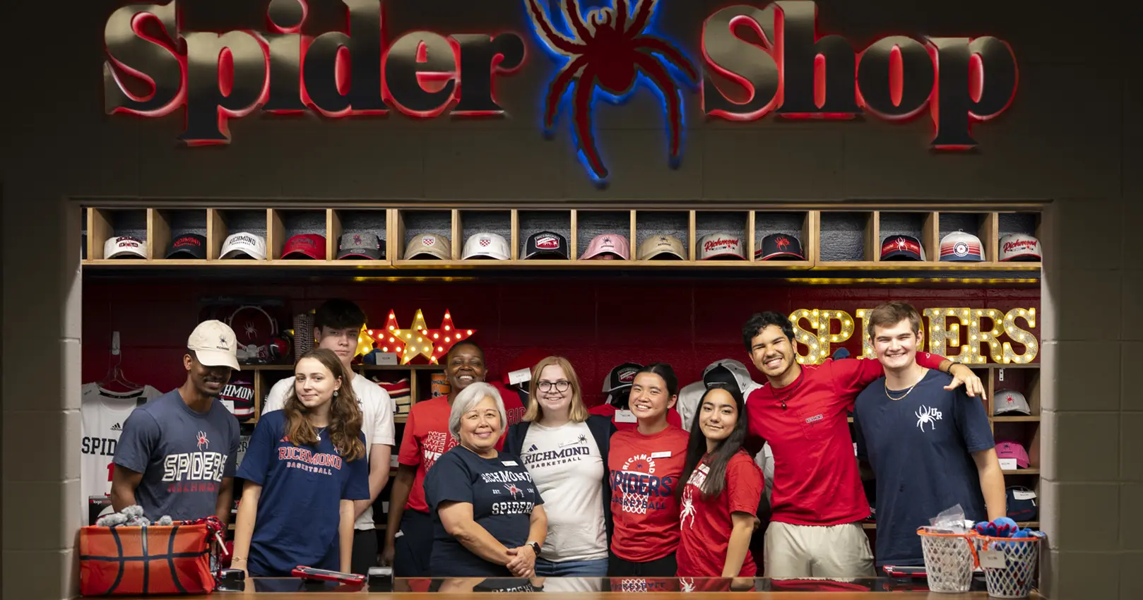 Welcome image with bookstore staff and customers